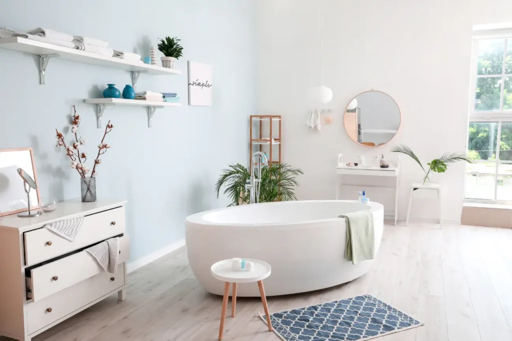 Bright modern bathroom with white bathtub and decor showcasing expert Bathroom Renovations New Plymouth.